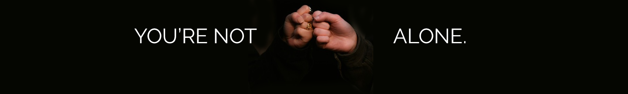 Two hands fist-pumping with caption, "You're Not Alone."
